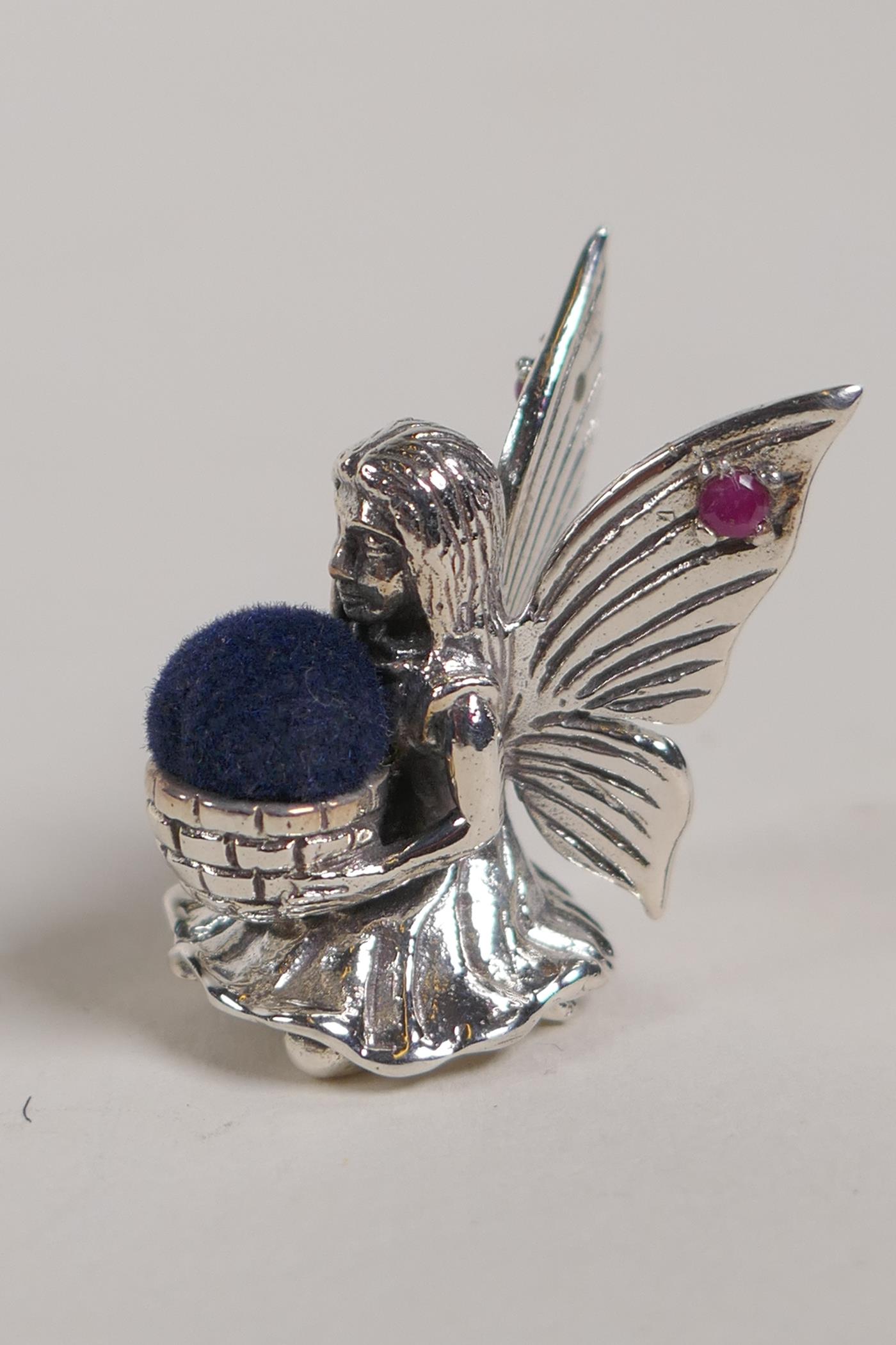 A Sterling silver fairy pincushion with rubies set to the wings, 1" high - Image 2 of 3