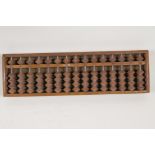 A Chinese wood abacus, 13" x 4"