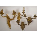 A pair of brass two light wall sconces and two ormolu two light sconces, largest 14"