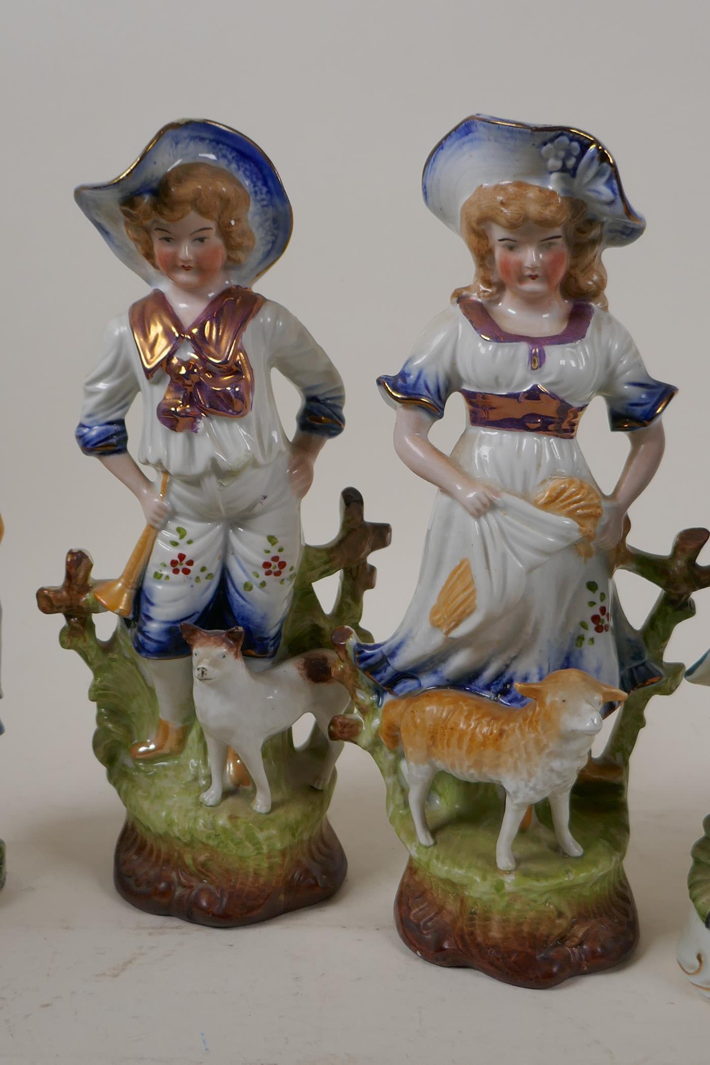 Two pairs of Continental porcelain figurines, largest 9½" high, and four other figurines - Image 3 of 5