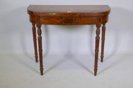 A Sheraton D shaped satinwood card table, with kingwood cross banded top and ebony strung frieze,