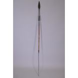 An early C20th African Maasai hunting spear, the tip with double edged leaf point and the butt