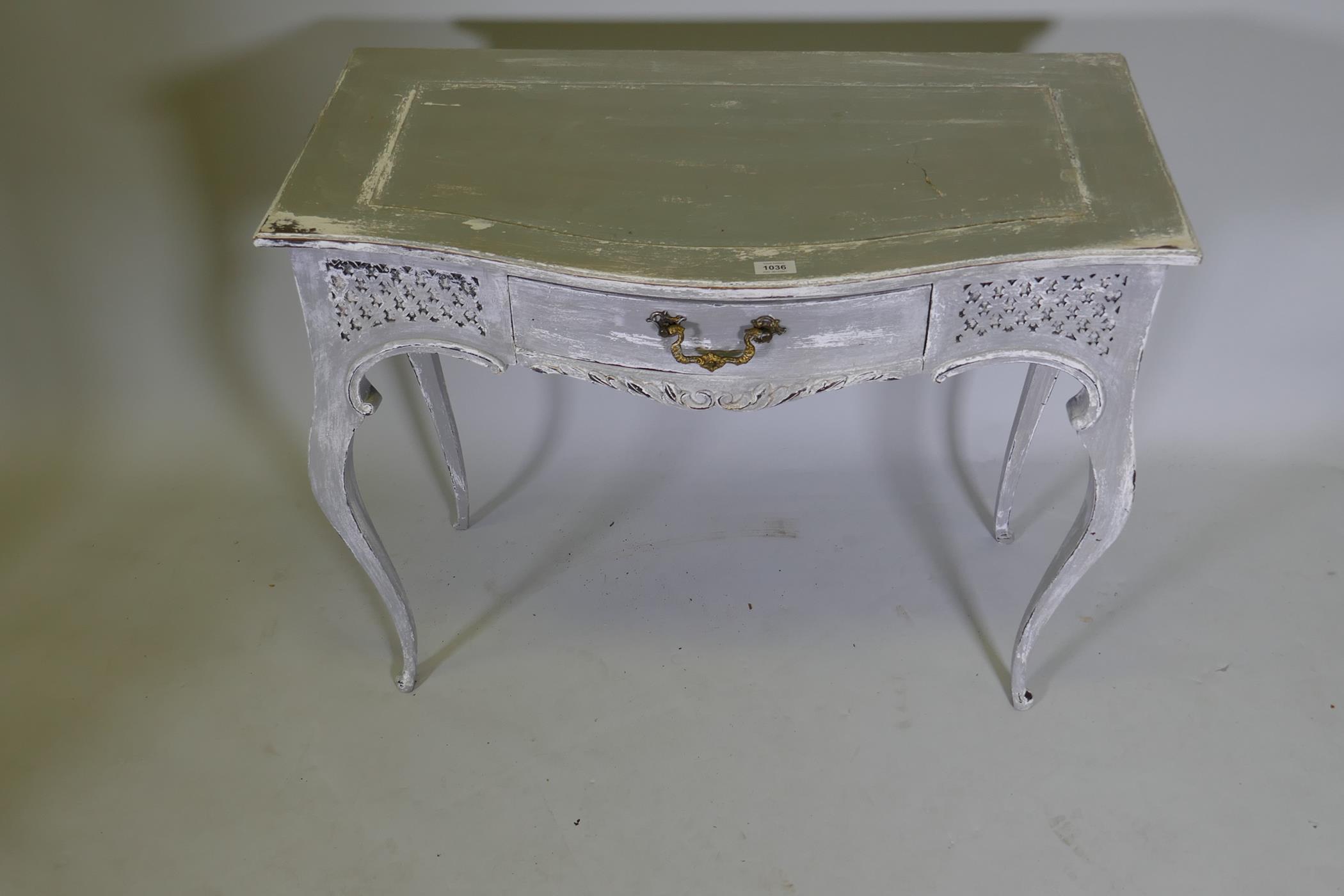 A serpentine front single drawer side table with carved and painted decoration, 36" x 19" x 29" - Image 2 of 4