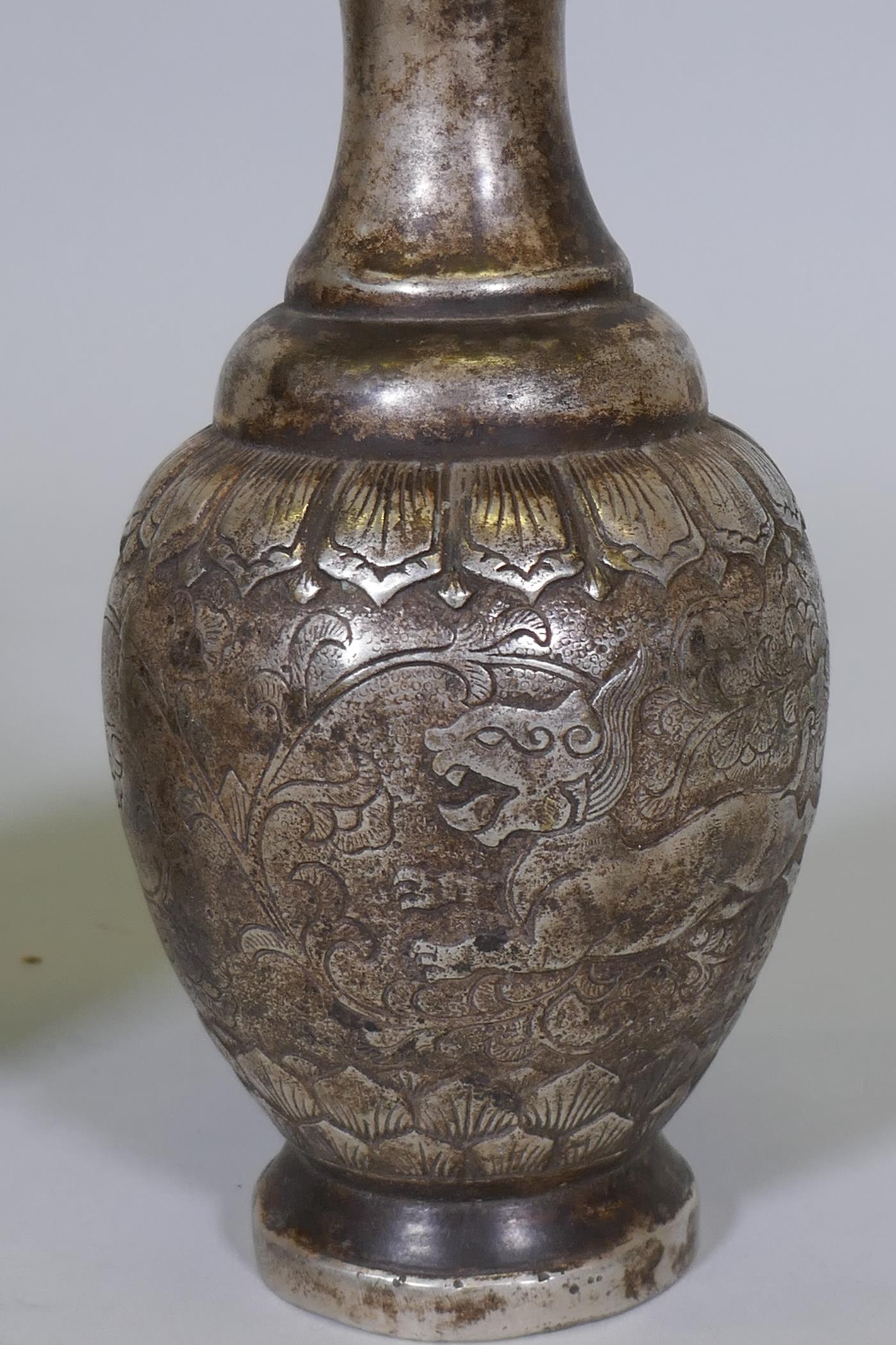 A pair of Chinese white metal vases with raised decoration depicting a lion chasing a deer, seal - Image 2 of 5