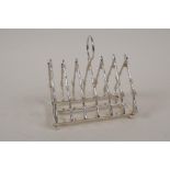 A silver plated toast rack modelled as a rifle rack, 4" long