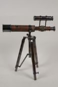 A brass table top telescope on extending tripod stand, 11" long