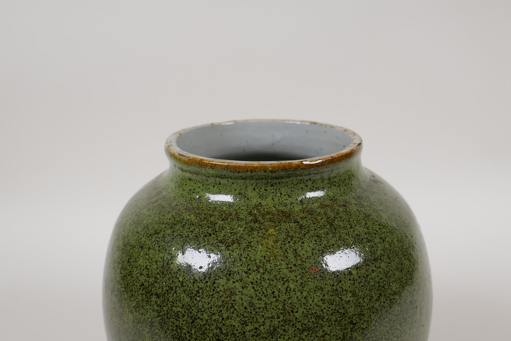 A Chinese green speckled glaze pottery jar, 7" high - Image 4 of 5