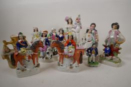 A pair of Staffordshire equestrian figures, 7½" high, together with eleven other Staffordshire