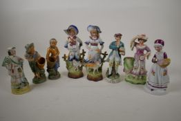Two pairs of Continental porcelain figurines, largest 9½" high, and four other figurines