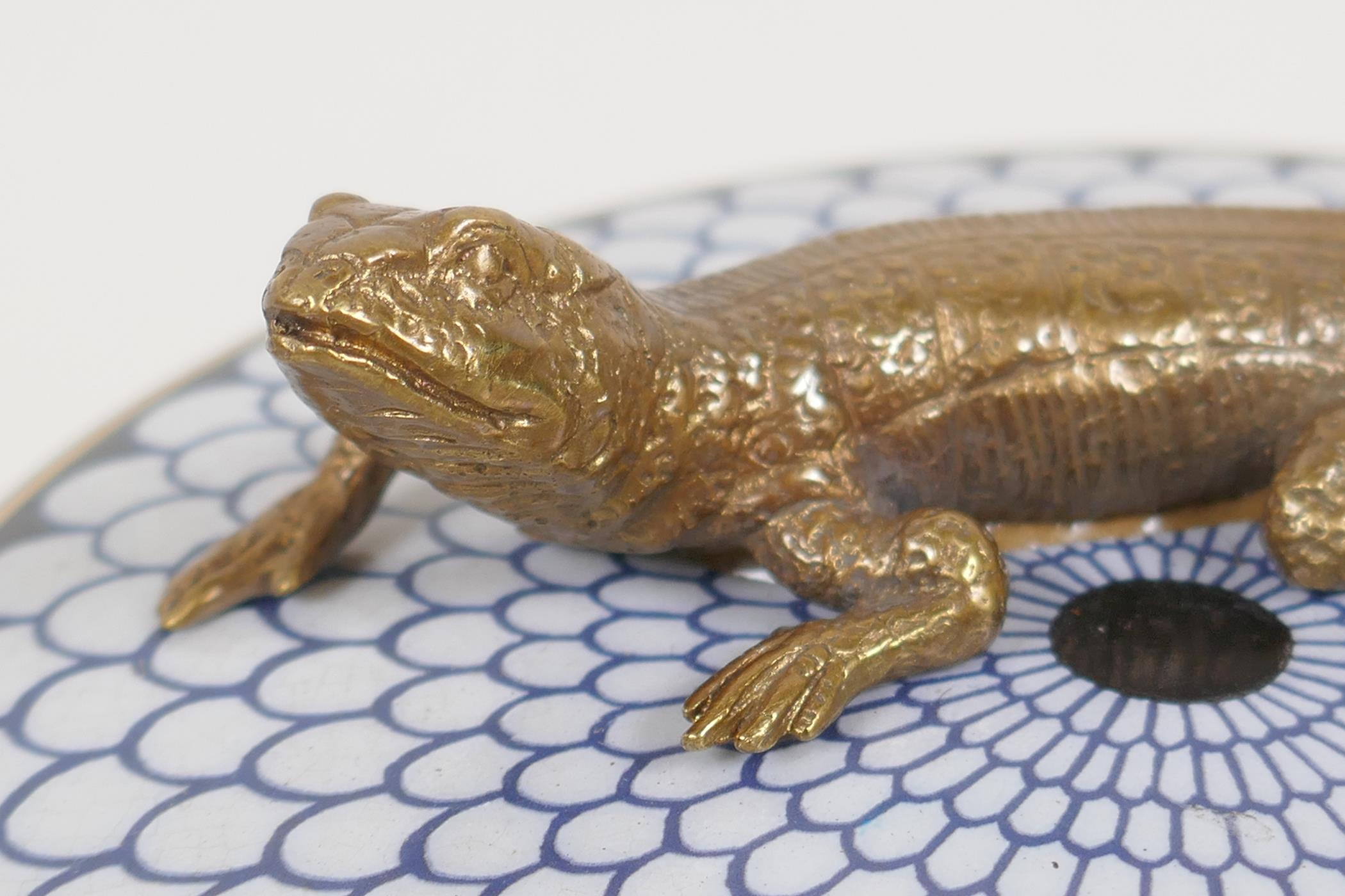 A porcelain trinket box, the cover with a bronzed figure of a lizard, 5½" diameter - Image 5 of 12