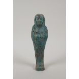 An Egyptian turquoise glazed faience shabti, 6½" high