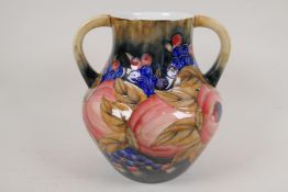 A Moorcroft style two handled bulbous vase, 10" high