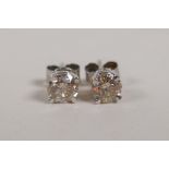 A pair of 14ct white gold and diamond stud earrings, approx 85 points