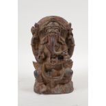An Indian bronze figure of Ganesh with gilt remnants, 7½" high