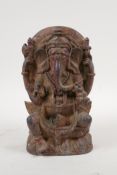 An Indian bronze figure of Ganesh with gilt remnants, 7½" high