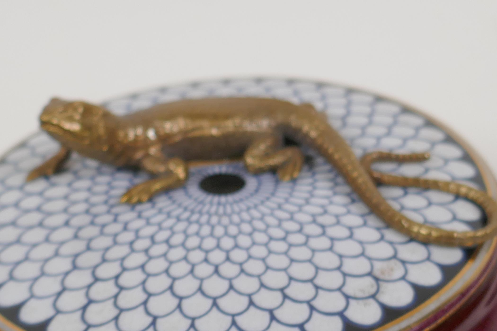 A porcelain trinket box, the cover with a bronzed figure of a lizard, 5½" diameter - Image 7 of 12