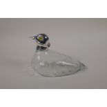 A silver plated and glass duck decanter, with inset glass eyes, 7" long