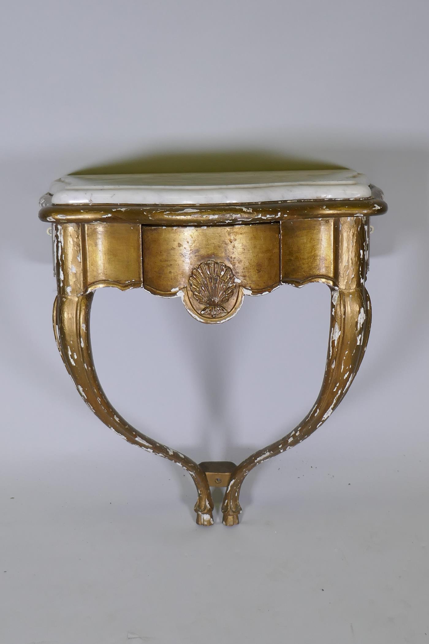 An Italian giltwood console table, with shaped marble top and single drawer, 21" x 17" x 24" high