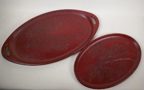 Two Chinese wood and lacquer trays with carved leaf decoration, largest 24" x 13"