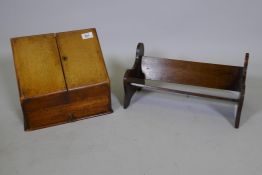 An oak bookrest, 16" long, and stationery cabinet with fitted interior and drawer