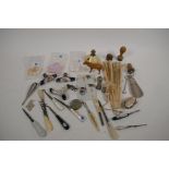 A quantity of bijouterie including three porcelain parasol handles, silver thimbles, button hooks,