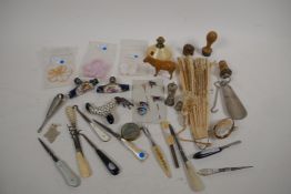 A quantity of bijouterie including three porcelain parasol handles, silver thimbles, button hooks,