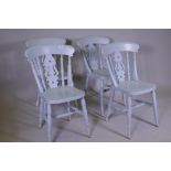 Four painted kitchen chairs, with pierced splat and spindle backs, raised on tuned supports