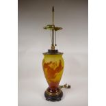 A continental yellow and amber cameo glass lamp in the Galle style, marked 'Andronic', with brass