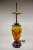 A continental yellow and amber cameo glass lamp in the Galle style, marked 'Andronic', with brass