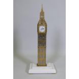 A 'Big Ben' brass skeleton clock with spring driven movement, mounted on a composite marble base,