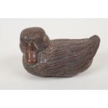 A Japanese carved wood okimono of a duck with stone set eyes, signed, 3" long