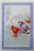 A Chinese polychrome porcelain panel depicting the immortal Qin Gao, 10" x 14"