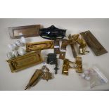 A quantity of brass, porcelain and iron door furniture, letter boxes, knockers, handles etc