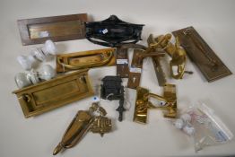 A quantity of brass, porcelain and iron door furniture, letter boxes, knockers, handles etc