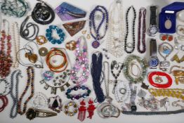 A collection of vintage costume jewellery, including silver items