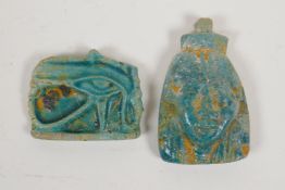 An Egyptian turquoise glazed faience pottery token in the form of the eye of Ra, and another in
