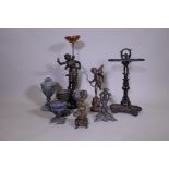 A quantity of metalware, metal lamps, urns and candle sticks and stick stand, 23" high