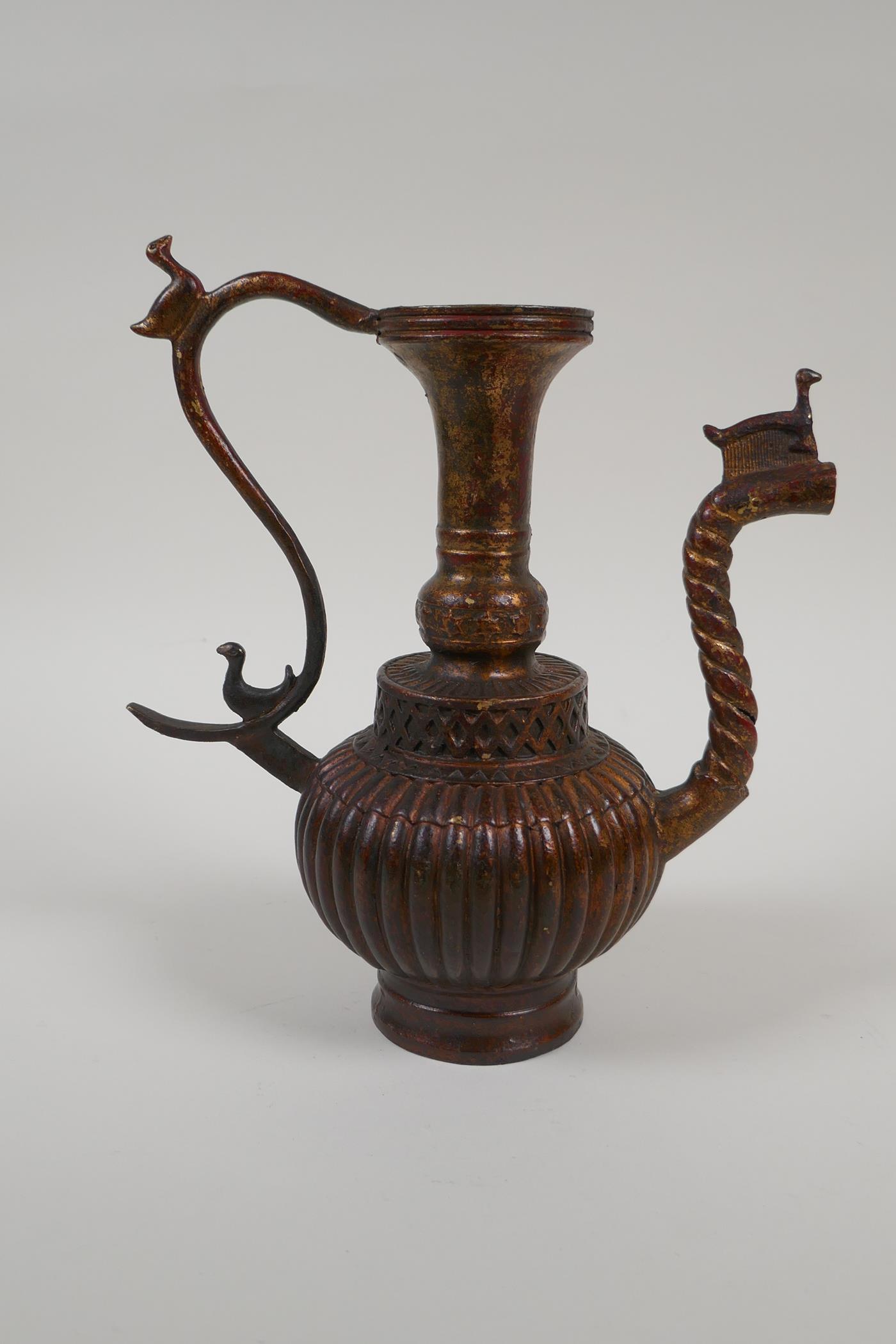 An Islamic gilt bronze ewer with a ribbed body, 9" high, spout AF - Image 4 of 8