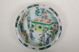 A famille vert porcelain dish with a rolled rim, decorated with an emperor and his court, Chinese