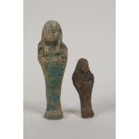 An Egyptian turquoise glazed faience shabti and another smaller, largest 4", AF repair