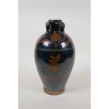 A Chinese Cizhou kiln pottery vase with lug handles and iridescent auspicious character