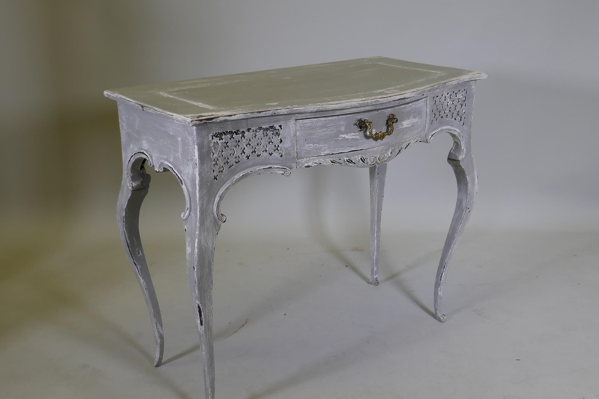 A serpentine front single drawer side table with carved and painted decoration, 36" x 19" x 29" - Image 3 of 4