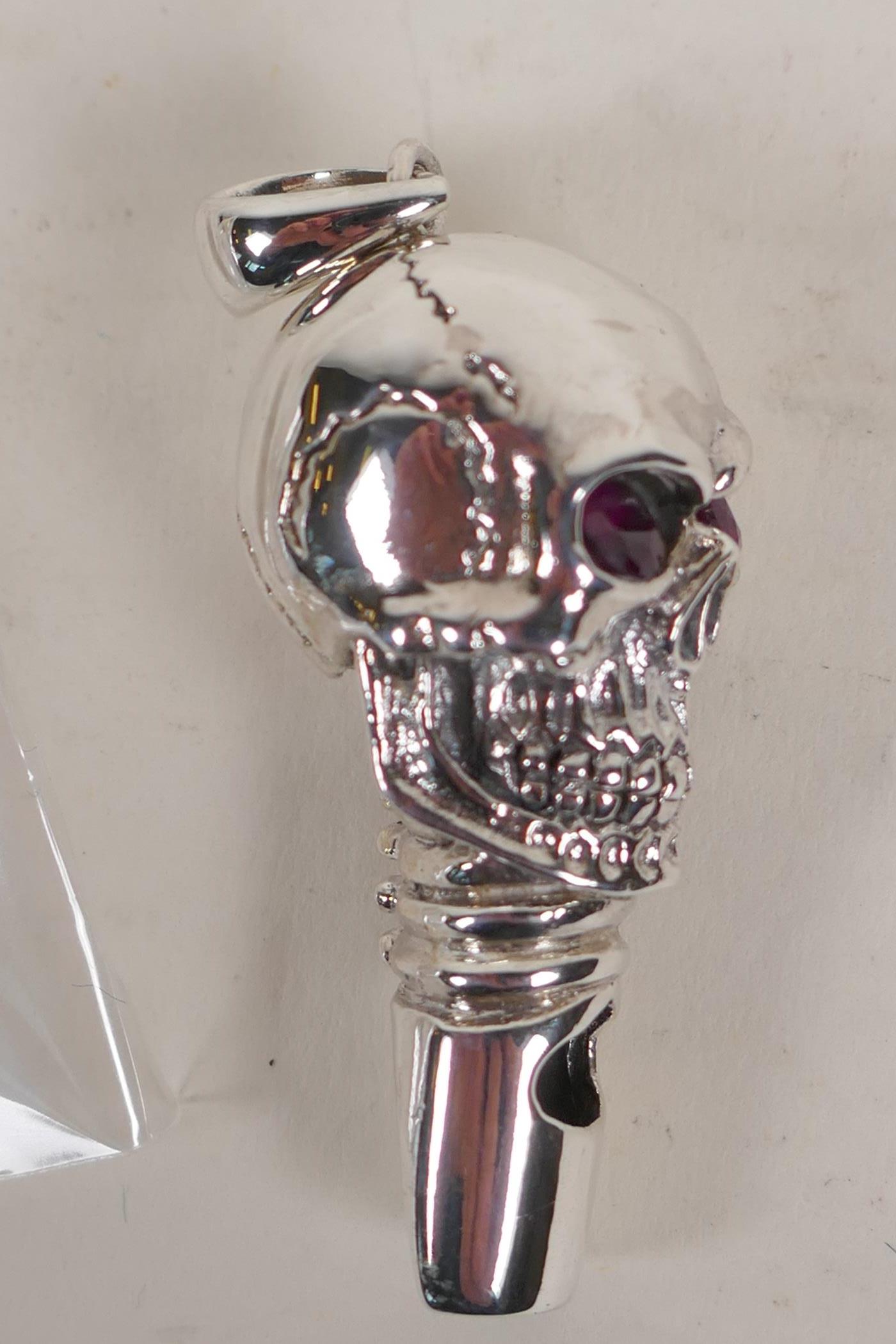 A sterling silver whistle modelled as a skull with ruby eyes - Image 4 of 4