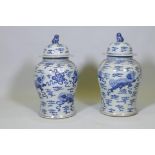 A pair of Chinese blue and white jars and covers with kylin decoration, 19" high
