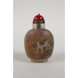 A Chinese reverse decorated glass snuff bottle depicting saddleback pigs, 3" high