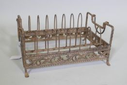 A metal carrying rack with pierced decoration, 12" x 9" x 6"