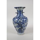 A Chinese blue and white porcelain two handled vase, the top separated to incorporate multiple