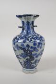 A Chinese blue and white porcelain two handled vase, the top separated to incorporate multiple