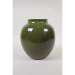 A Chinese green speckled glaze pottery jar, 7" high