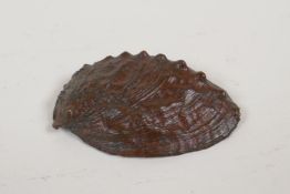 A Japanese bronze okimono of an oyster shell, indistinct impressed mark to interior, 3" wide